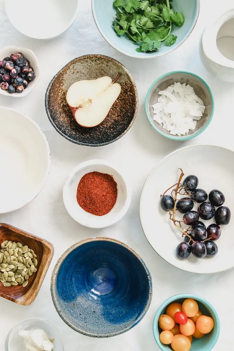 Save Food Scraps An overhead shot of fruits, seeds and spices in bowls