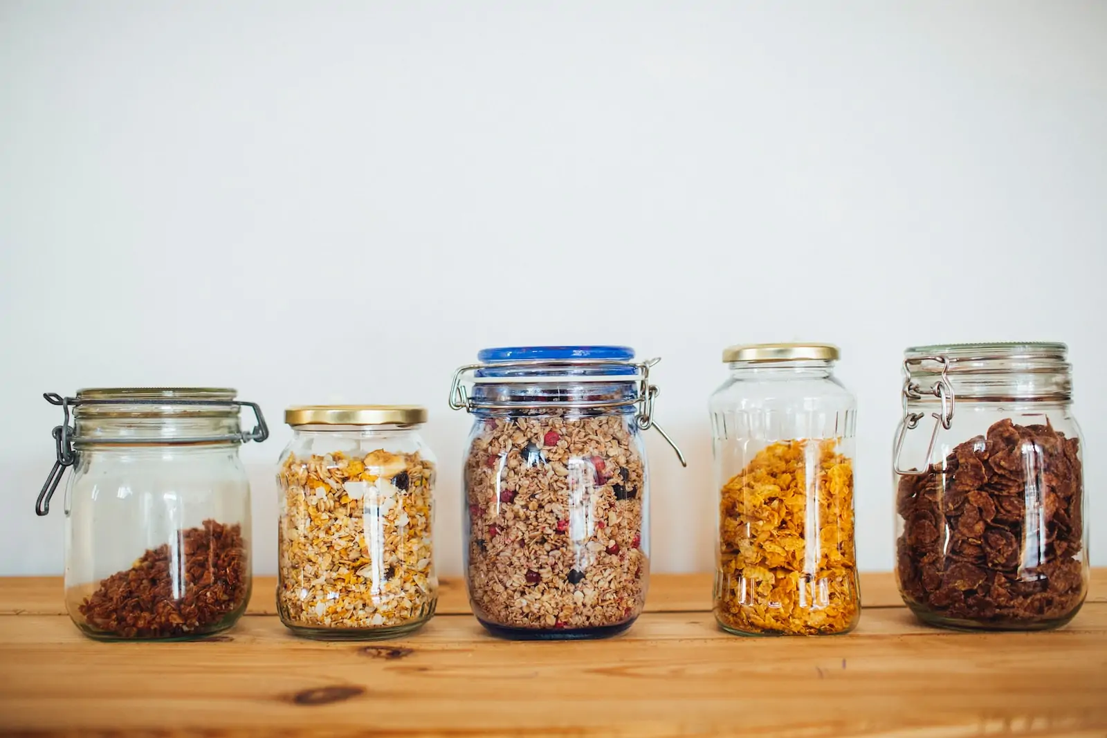 sustainable home food packaging two clear glass jars with brown and black beads