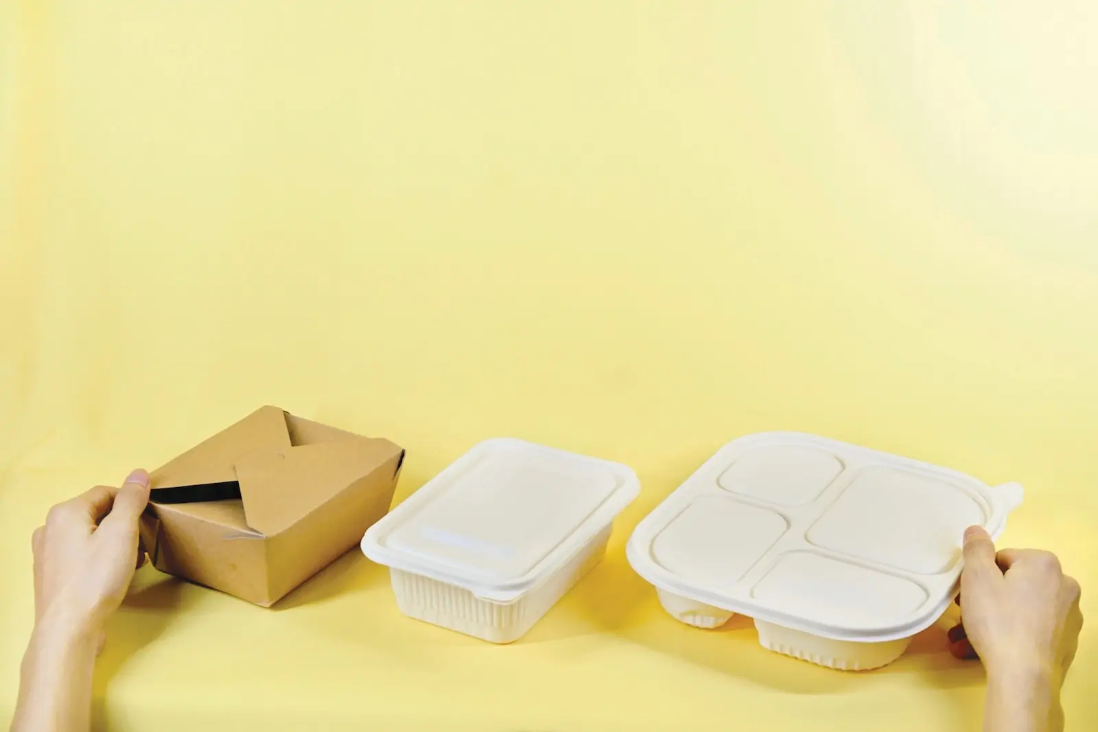 sustainable home food packaging a person holding a box and two take out containers